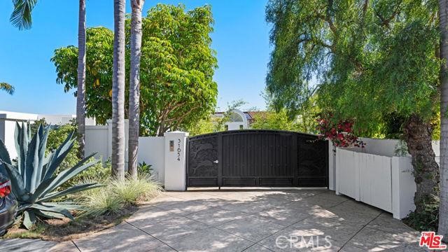 31654 Broad Beach Road Malibu, CA 90265 - Photo 42 of 75 a front view of a house with a yard and potted plants