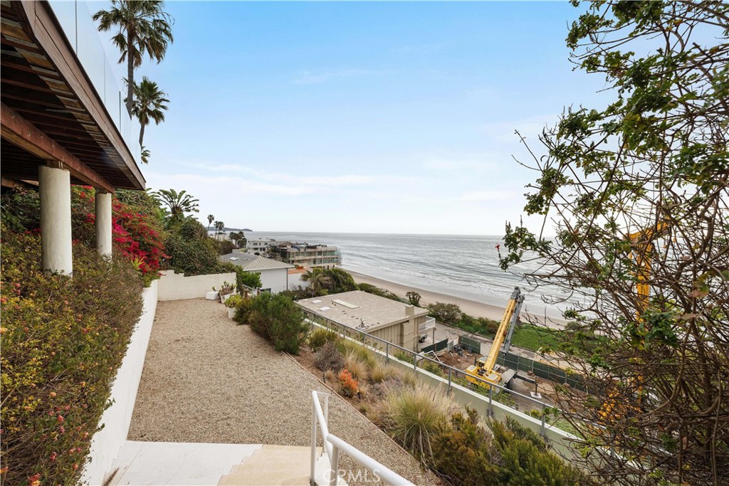 31654 Broad Beach Road Malibu, CA 90265 - Photo 68 of 75 a view of a terrace with wooden floor and fence