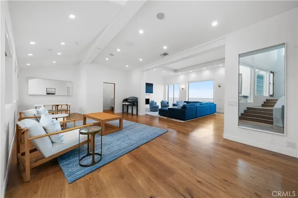 a living room with couches and a coffee table