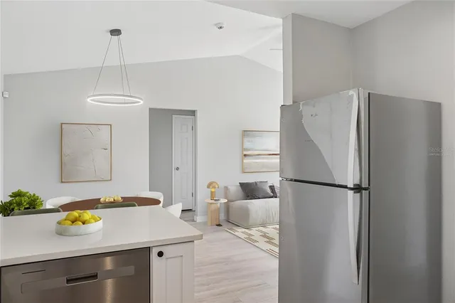 a kitchen with appliances cabinets and a sink