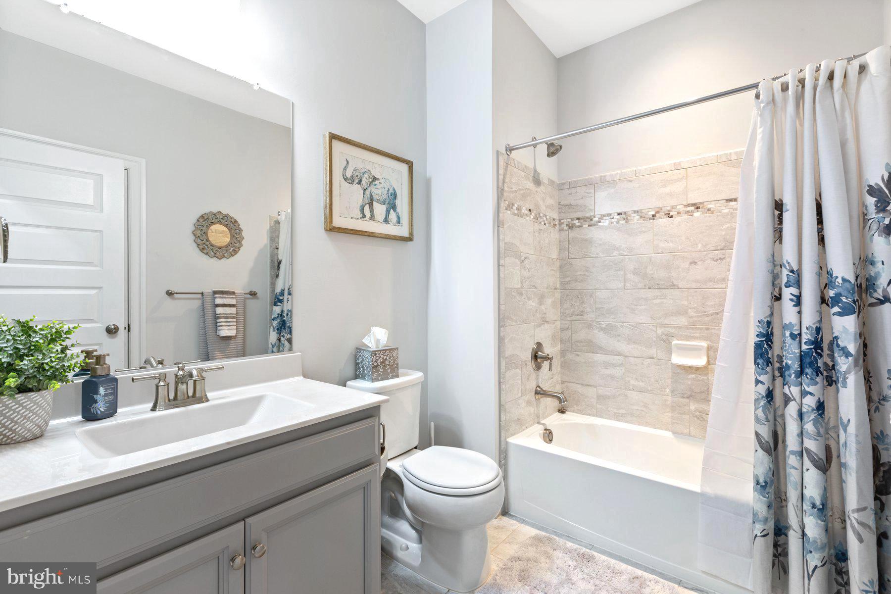 12508 Barnard Court Brandywine, MD 20613 - Photo 18 of 35 a bathroom with a sink toilet and shower