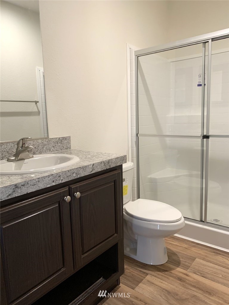 4590 Lake Terrell Road Ferndale, WA 98248 - Photo 17 of 25 a bathroom with a granite countertop sink toilet and shower