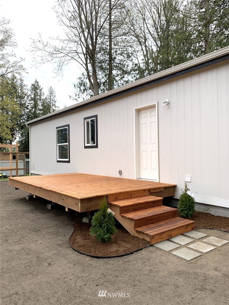 4590 Lake Terrell Road Ferndale, WA 98248 - Photo 20 of 25 a backyard of a house with table and chairs