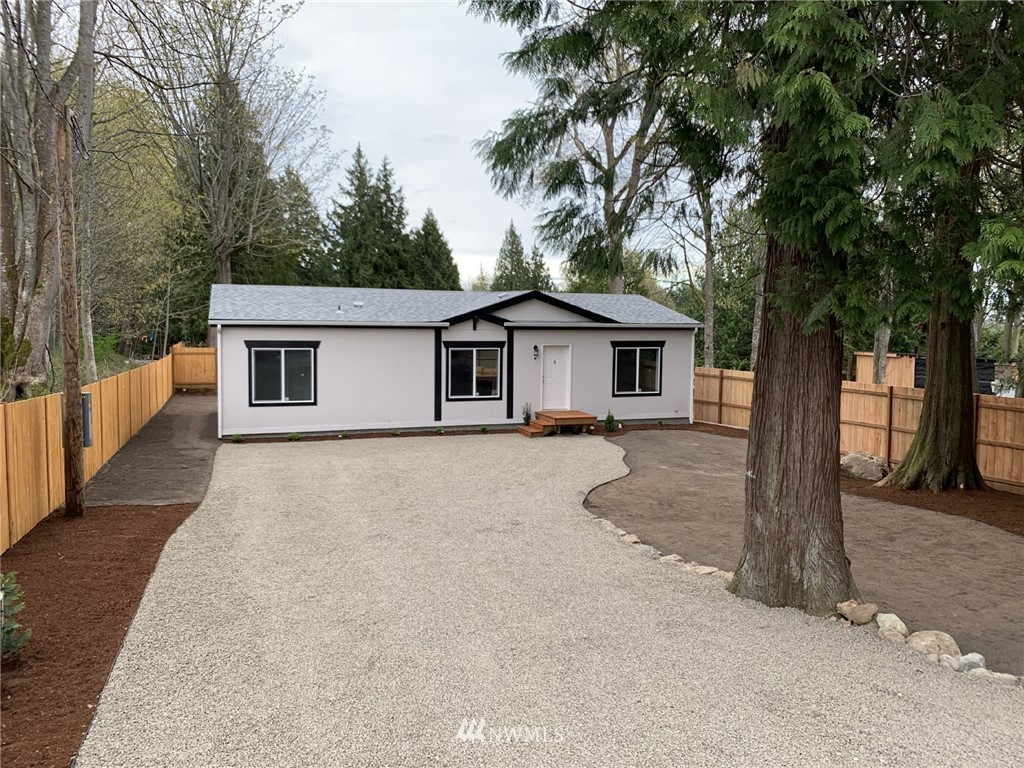 4590 Lake Terrell Road Ferndale, WA 98248 - Photo 3 of 25 a house with trees in the background