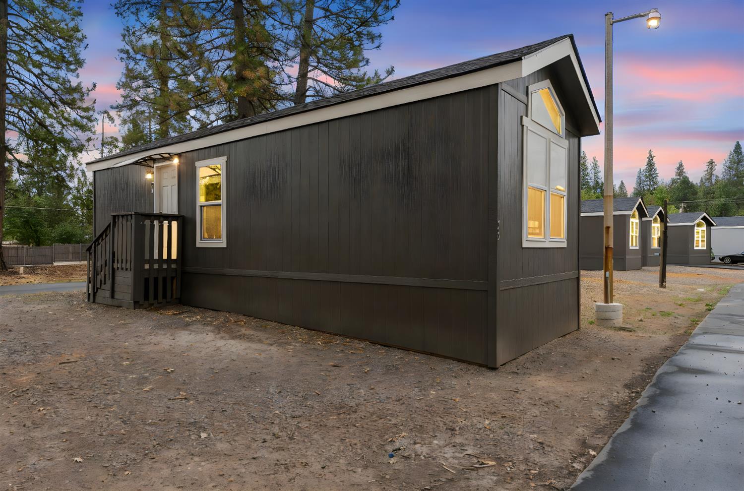 a view of backyard with cabin