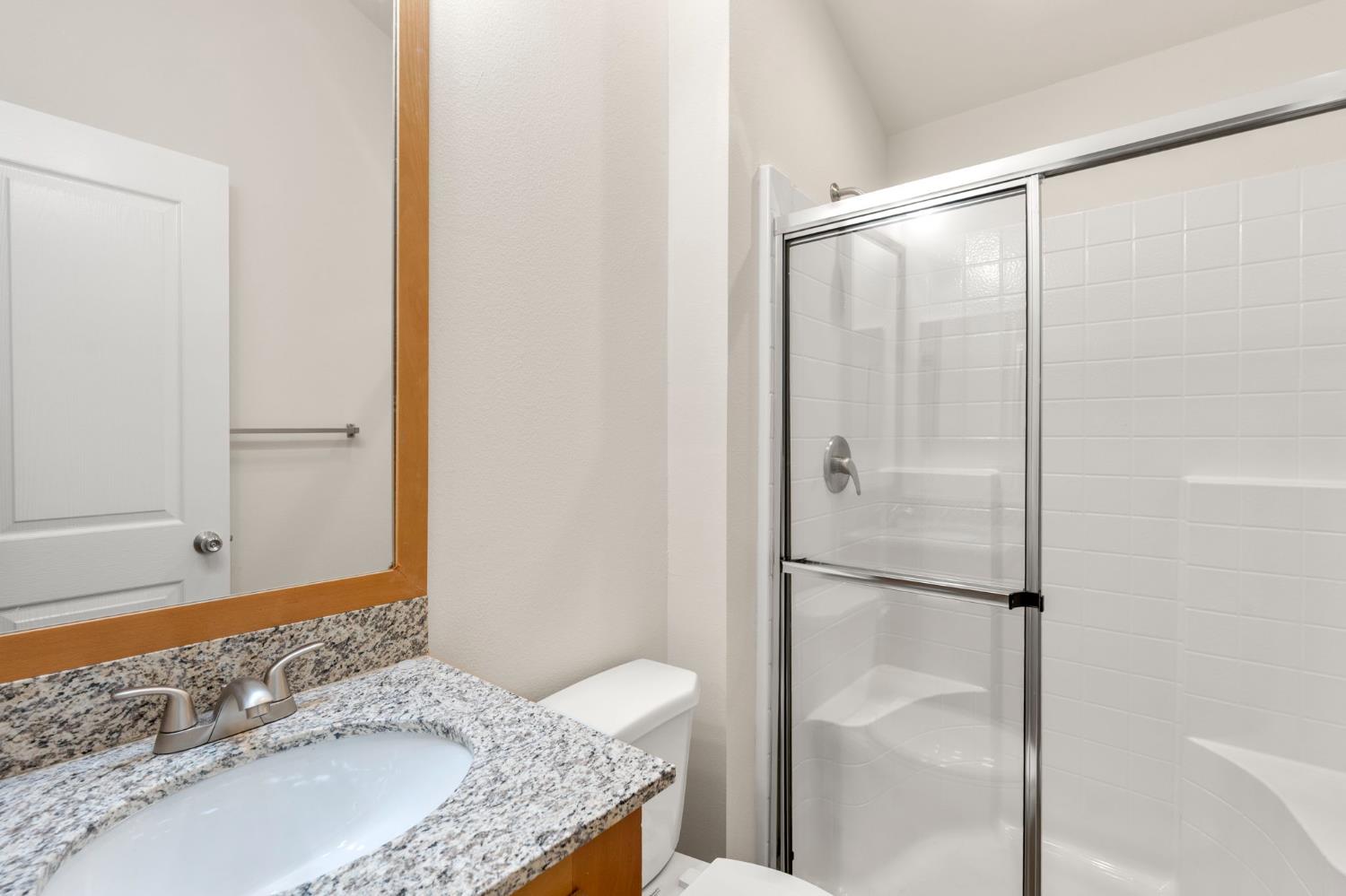 4482 Moran Road, Unit 56 Avery, CA 95224 - Photo 14 of 17 a bathroom with a granite countertop shower and a sink
