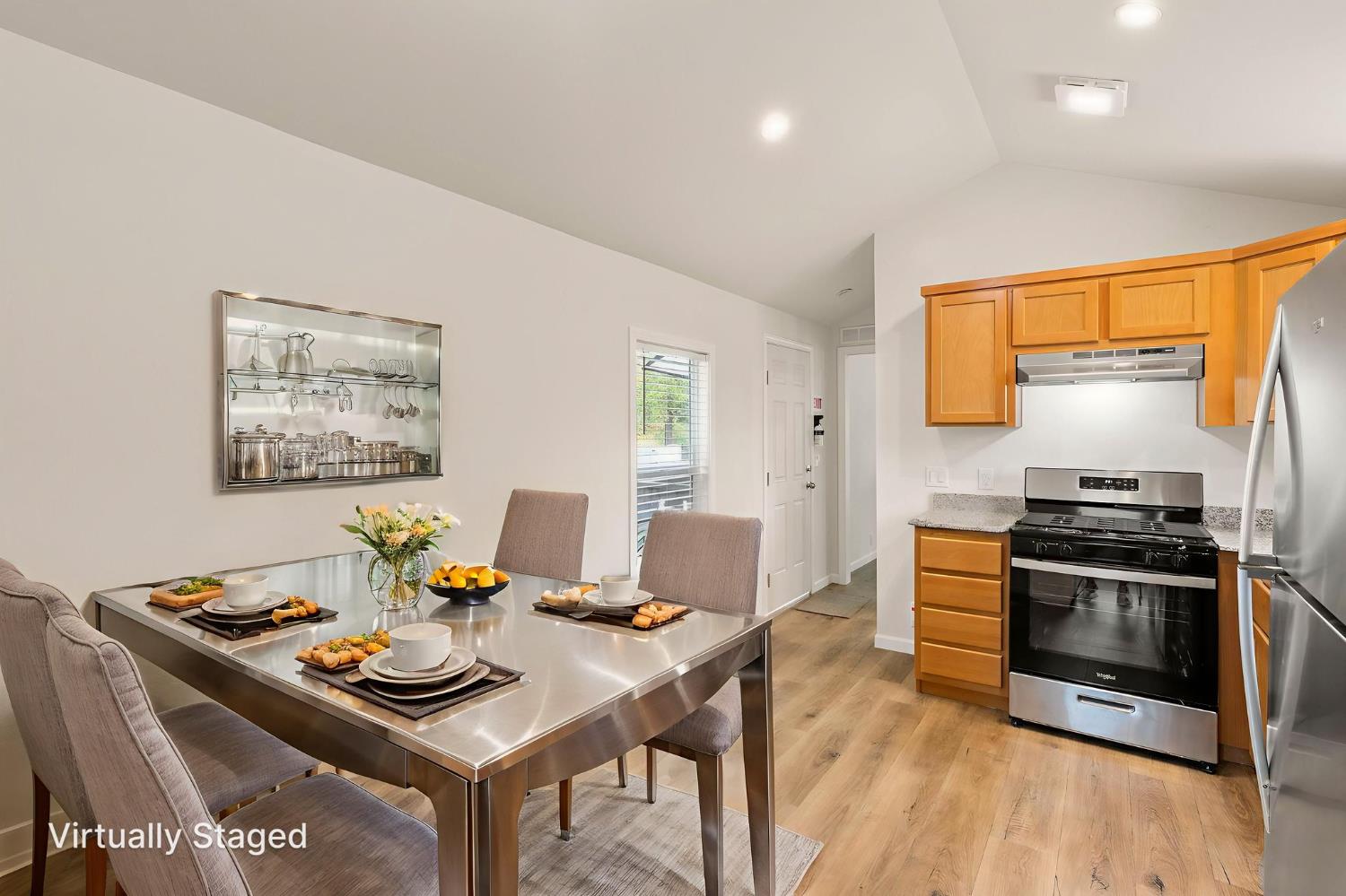 4482 Moran Road, Unit 56 Avery, CA 95224 - Photo 10 of 17 a kitchen with stainless steel appliances a stove a table and chairs