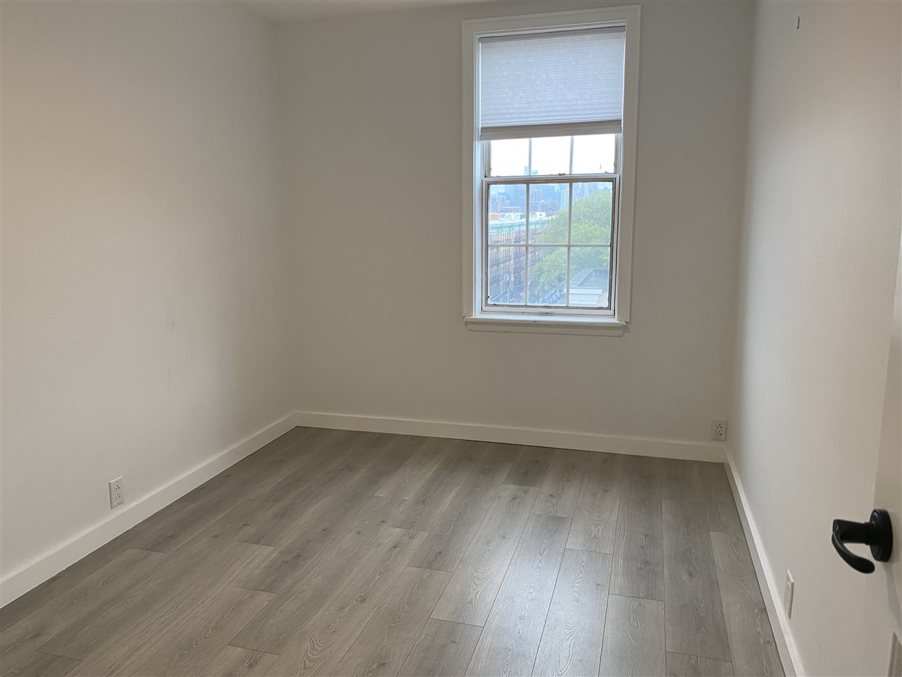 1024 Clinton Street, Unit 502 Hoboken, NJ 07030 - Photo 5 of 17 an empty room with a window
