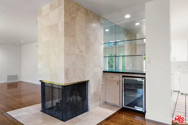 a hallway with sliding door and staircase
