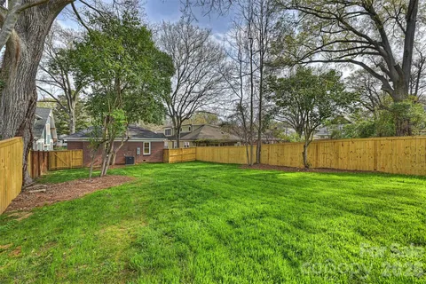 a view of a backyard with green space