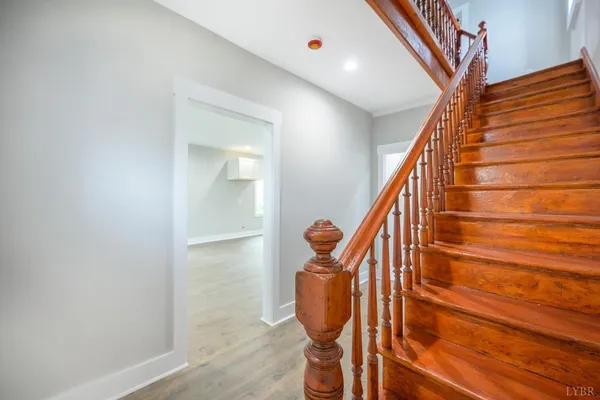 a view of kitchen with wooden floor and electronic appliances