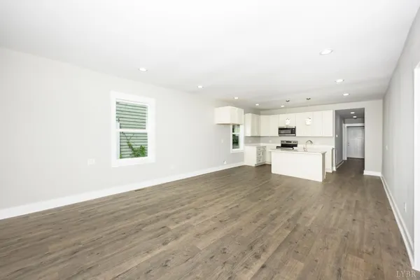 a view of a kitchen with wooden floor