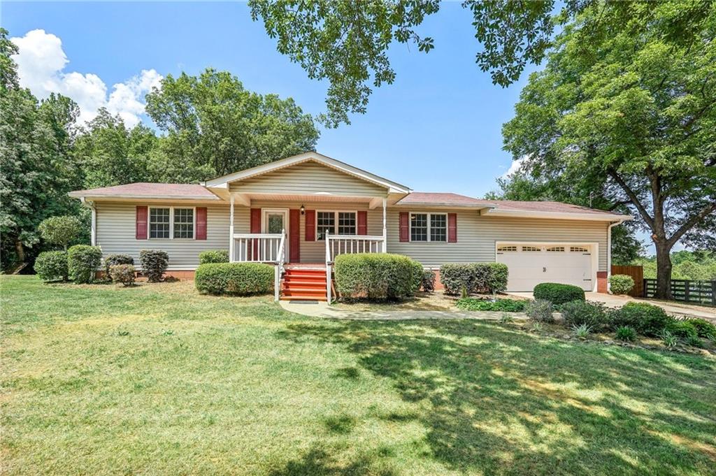 a view of a house with a yard