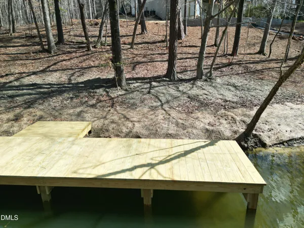 a view of swimming pool with a yard