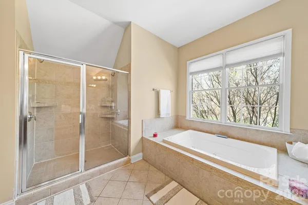 a kitchen with stainless steel appliances kitchen island granite countertop a sink and cabinets