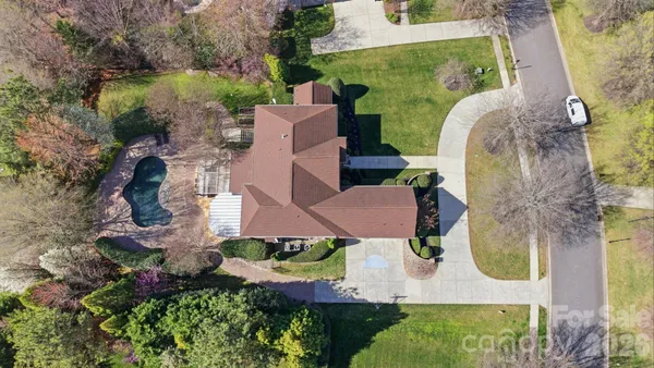 an aerial view of a house with outdoor space