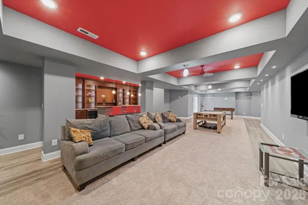 a building outdoor space with patio furniture and wooden floor