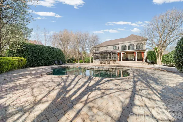 an aerial view of a house with outdoor space