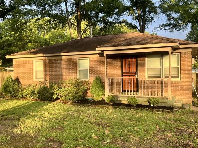 170 Wilson Street Collierville, TN 38017 - Photo 1 of 2 Brick exterior with a covered front porch featuring a wood-paneled door
