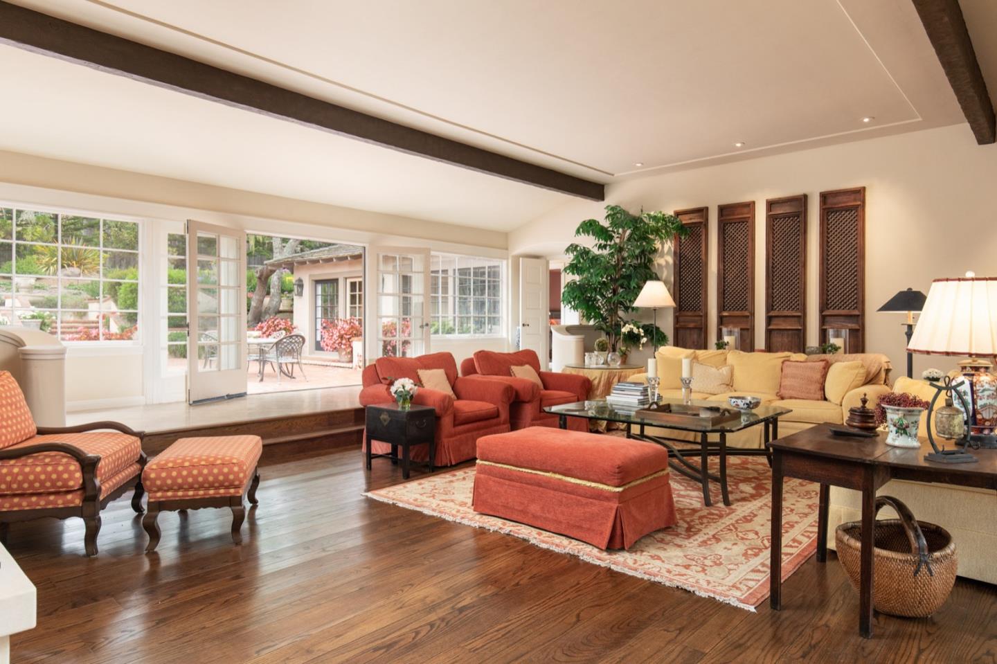 1427 Riata Road Pebble Beach, CA 93953 - Photo 6 of 24 a living room with furniture and a large window
