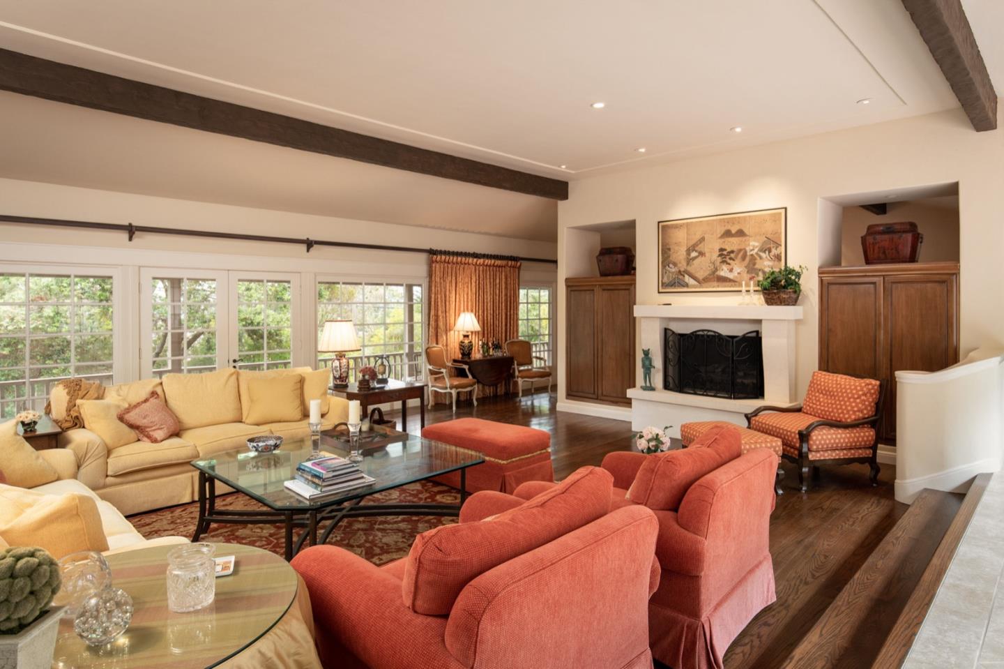 1427 Riata Road Pebble Beach, CA 93953 - Photo 7 of 24 a living room with furniture fireplace and a large window