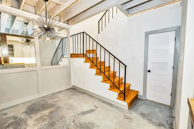a white toilet sitting next to a bathroom sink