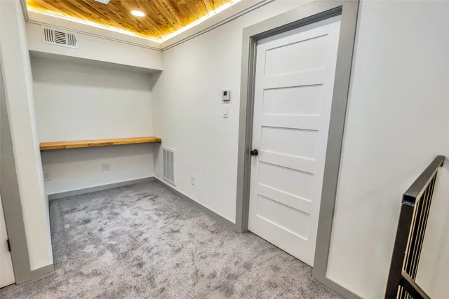 a bathroom with a toilet and a tub