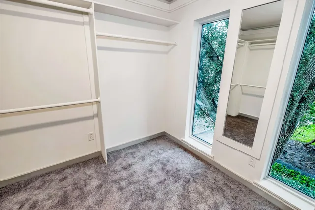 a view of empty room with floor to ceiling window