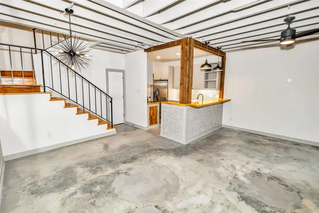 a view of a hallway with staircase