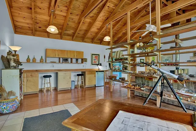 a living room with lots of furniture and a rug