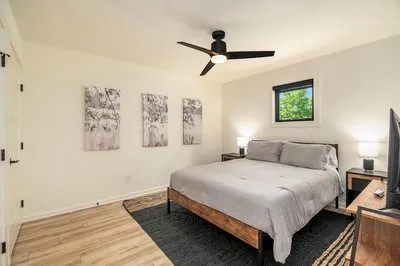 a living room with furniture and a floor to ceiling window