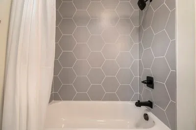 a living room with furniture and a large window with outer view