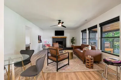a bathroom with a granite countertop sink toilet a mirror a vanity and shower