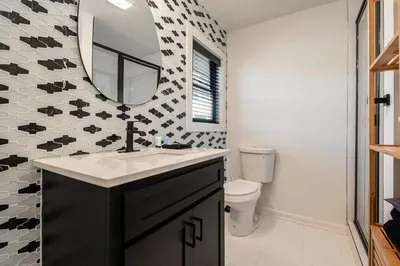 a bedroom with a bed furniture and a wooden floor