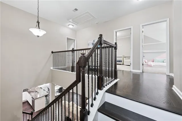 a view of entryway and hall with wooden floor