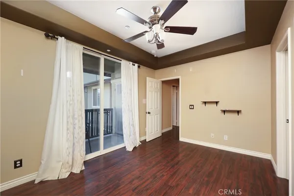 a view of an entryway with wooden floor