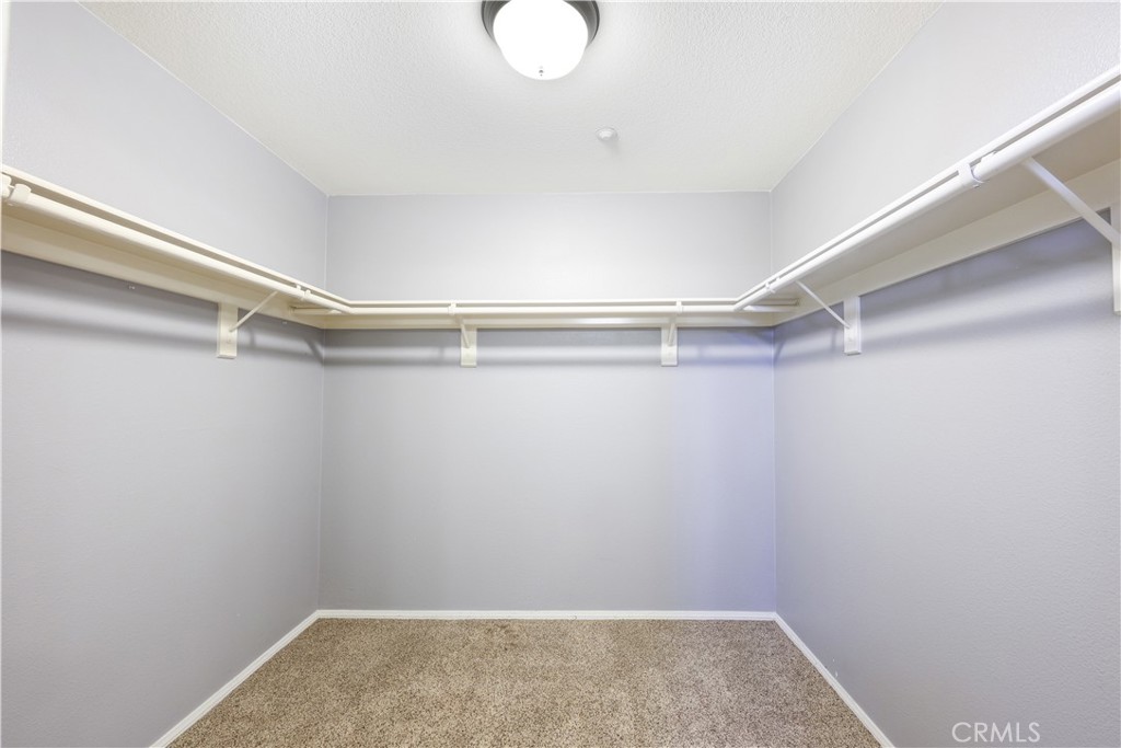 155 Zephyr Run Tustin, CA 92782 - Photo 7 of 29 1st Floor Bedroom Walk-In Closet