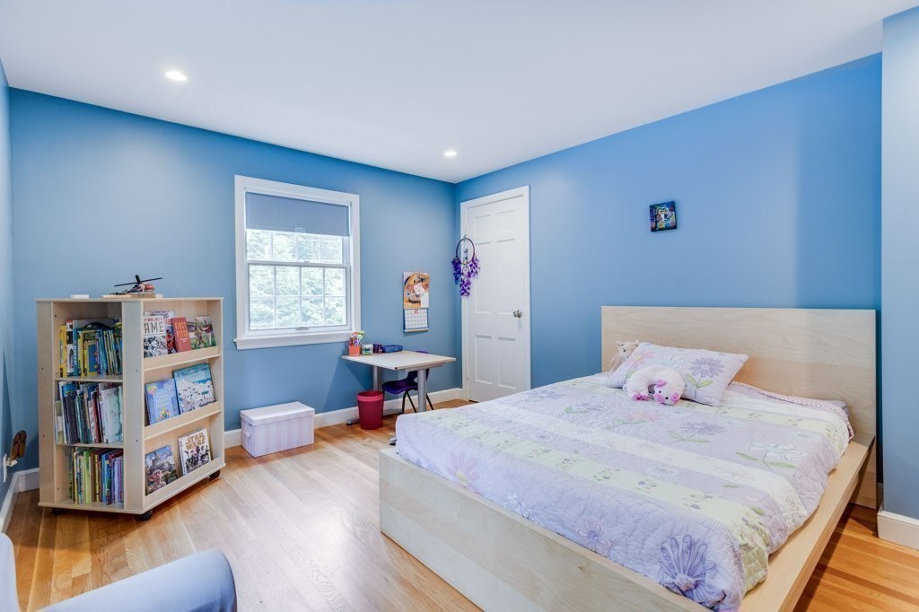 226 Conant Road Weston, MA 02493 - Photo 16 of 23 a bedroom with a bed and a window