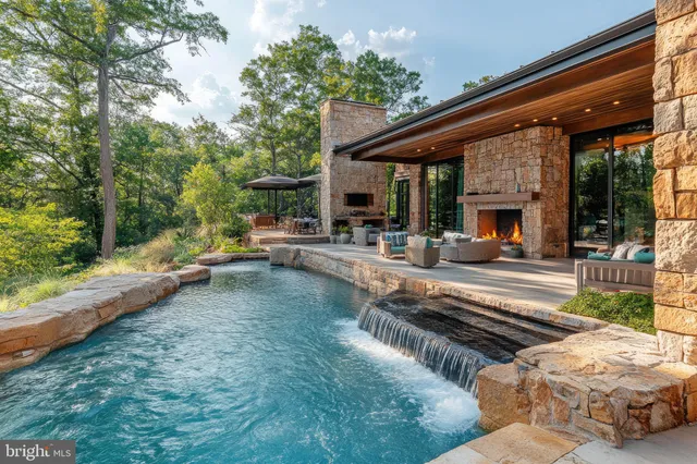 a view of a patio with couches chairs and a table and chairs with wooden floor