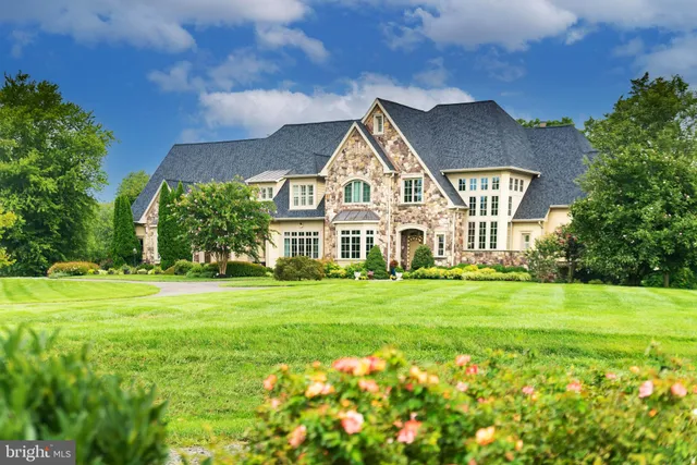 a front view of a house with a big yard