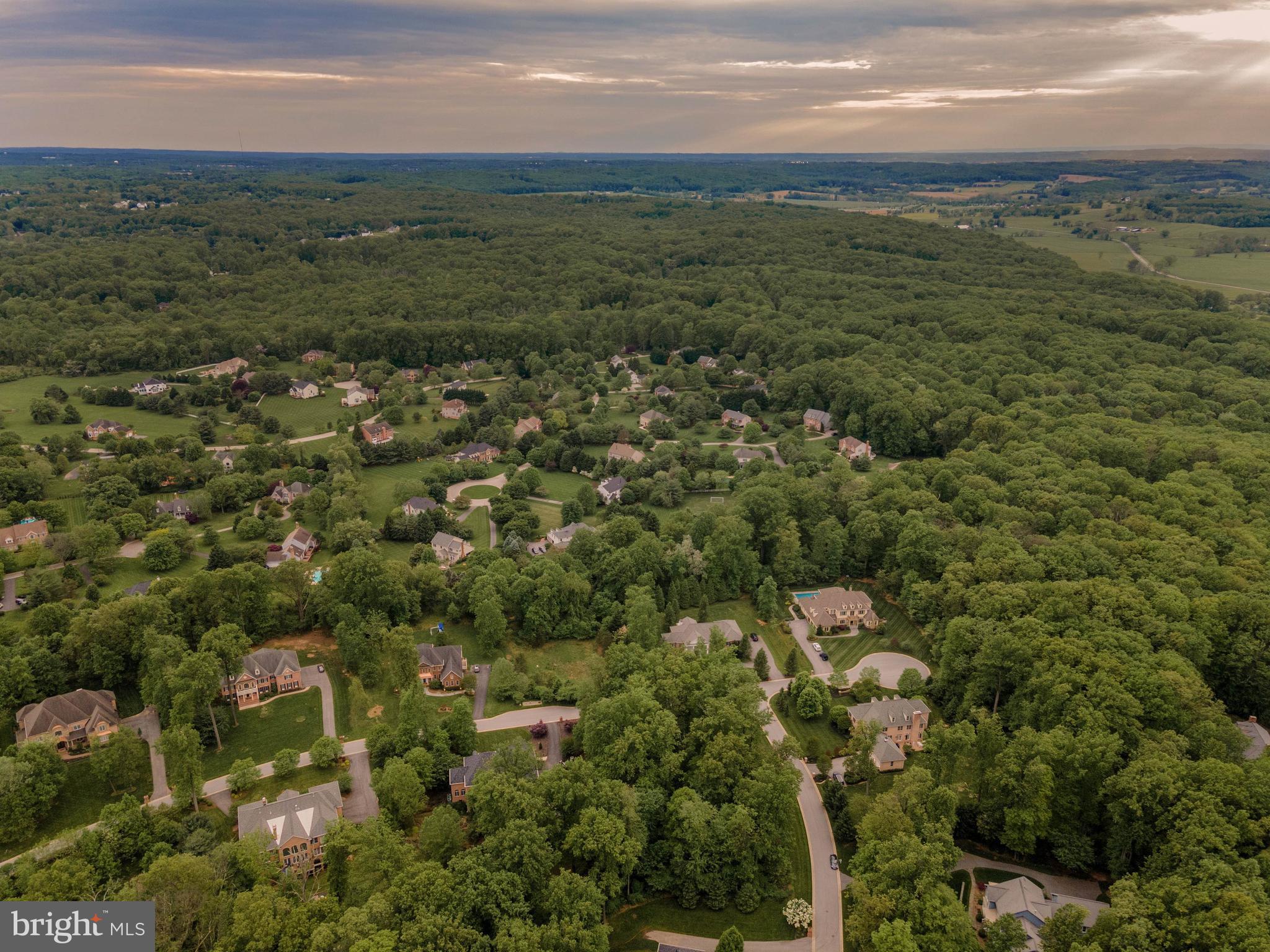 1 Norfolk Court Reisterstown, MD 21136 - Photo 4 of 16 a view of a field with an ocean and trees