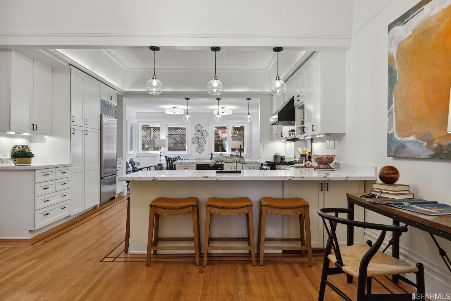 151 Broderick Street San Francisco, CA 94117 - Photo 12 of 39 a kitchen with stainless steel appliances granite countertop a table chairs stove and sink
