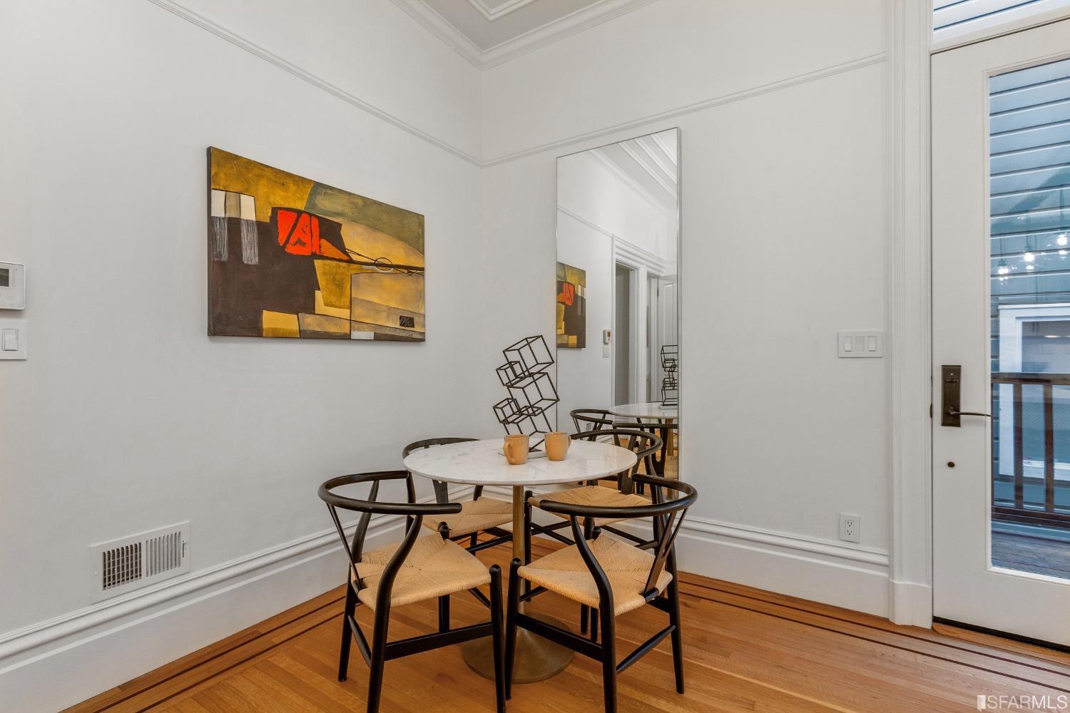 151 Broderick Street San Francisco, CA 94117 - Photo 14 of 39 a dining room with furniture and wooden floor