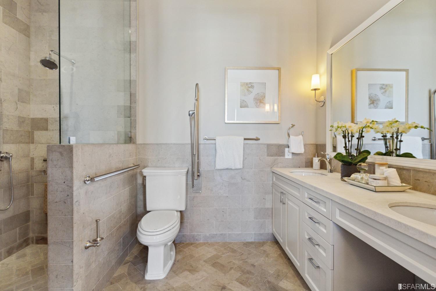 151 Broderick Street San Francisco, CA 94117 - Photo 18 of 39 a bathroom with a granite countertop sink a toilet and a mirror