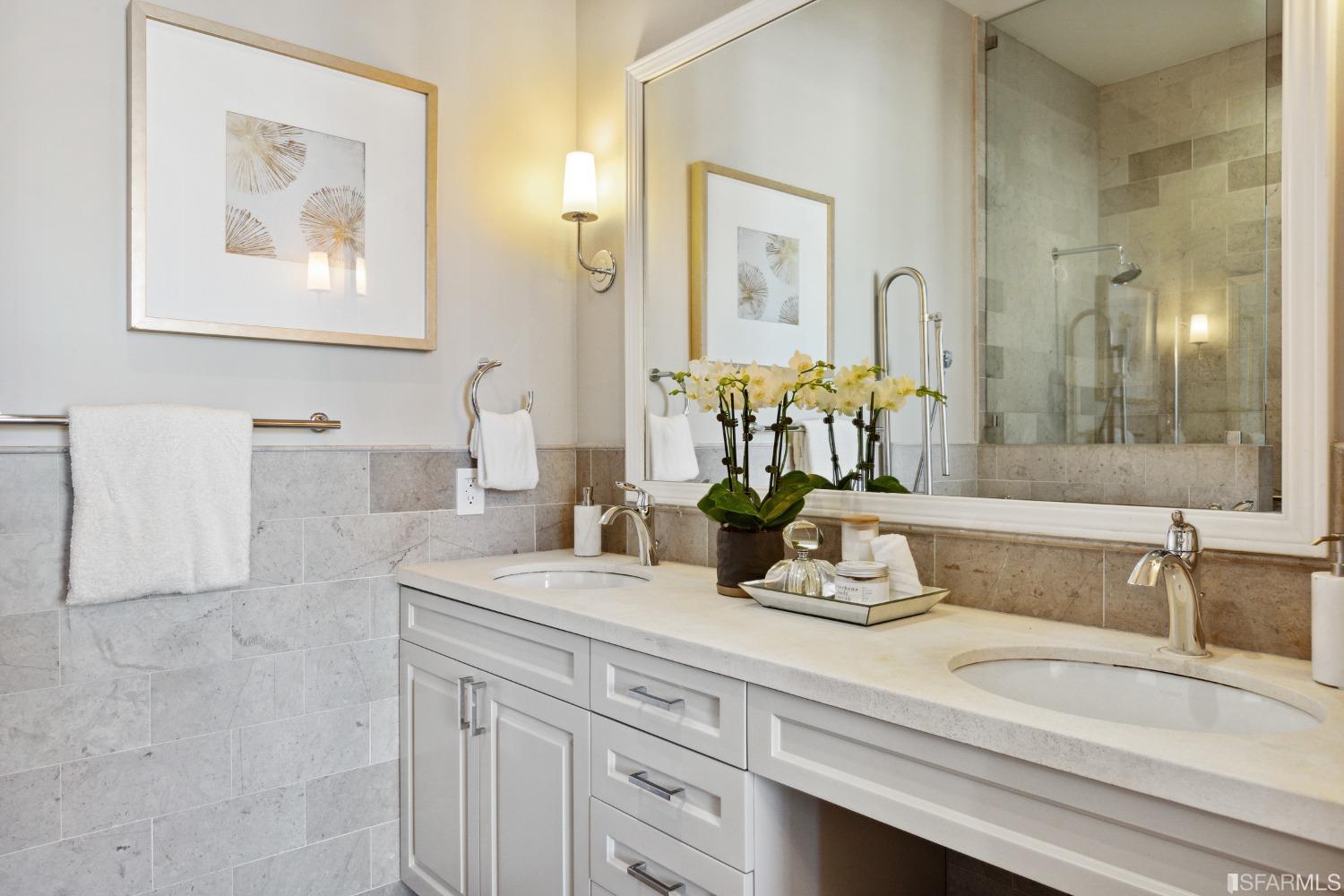 151 Broderick Street San Francisco, CA 94117 - Photo 19 of 39 a bathroom with a double vanity sink and a mirror
