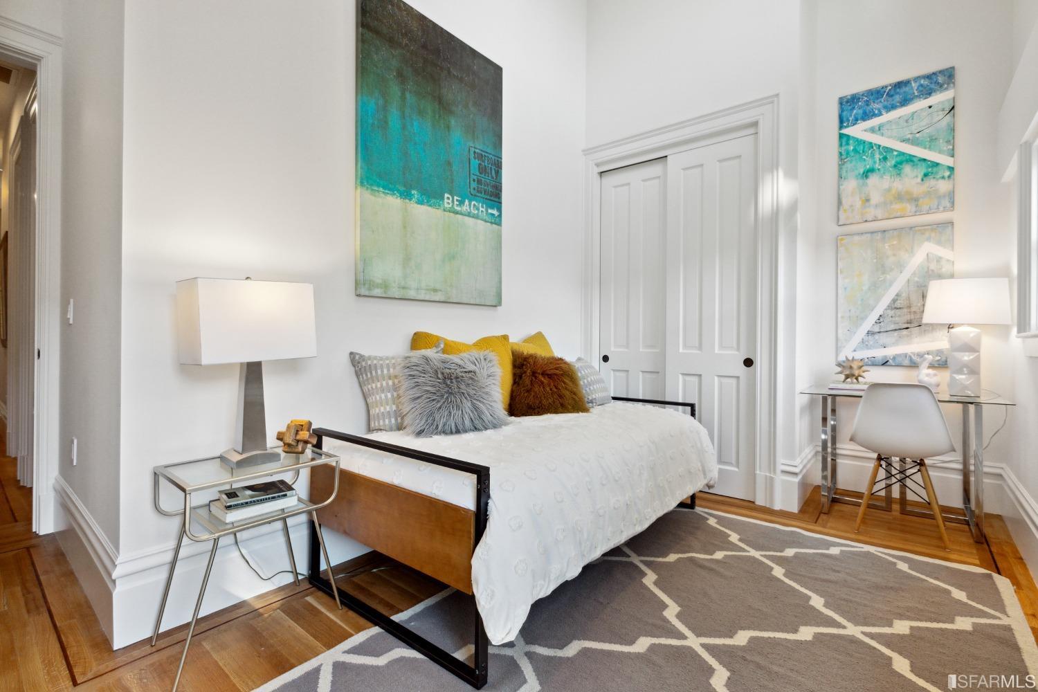 151 Broderick Street San Francisco, CA 94117 - Photo 22 of 39 a bedroom with a bed and a table in it