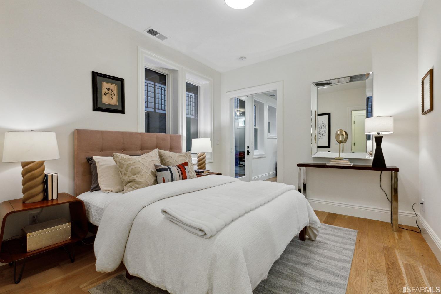 151 Broderick Street San Francisco, CA 94117 - Photo 30 of 39 a bedroom with bed and a night stand