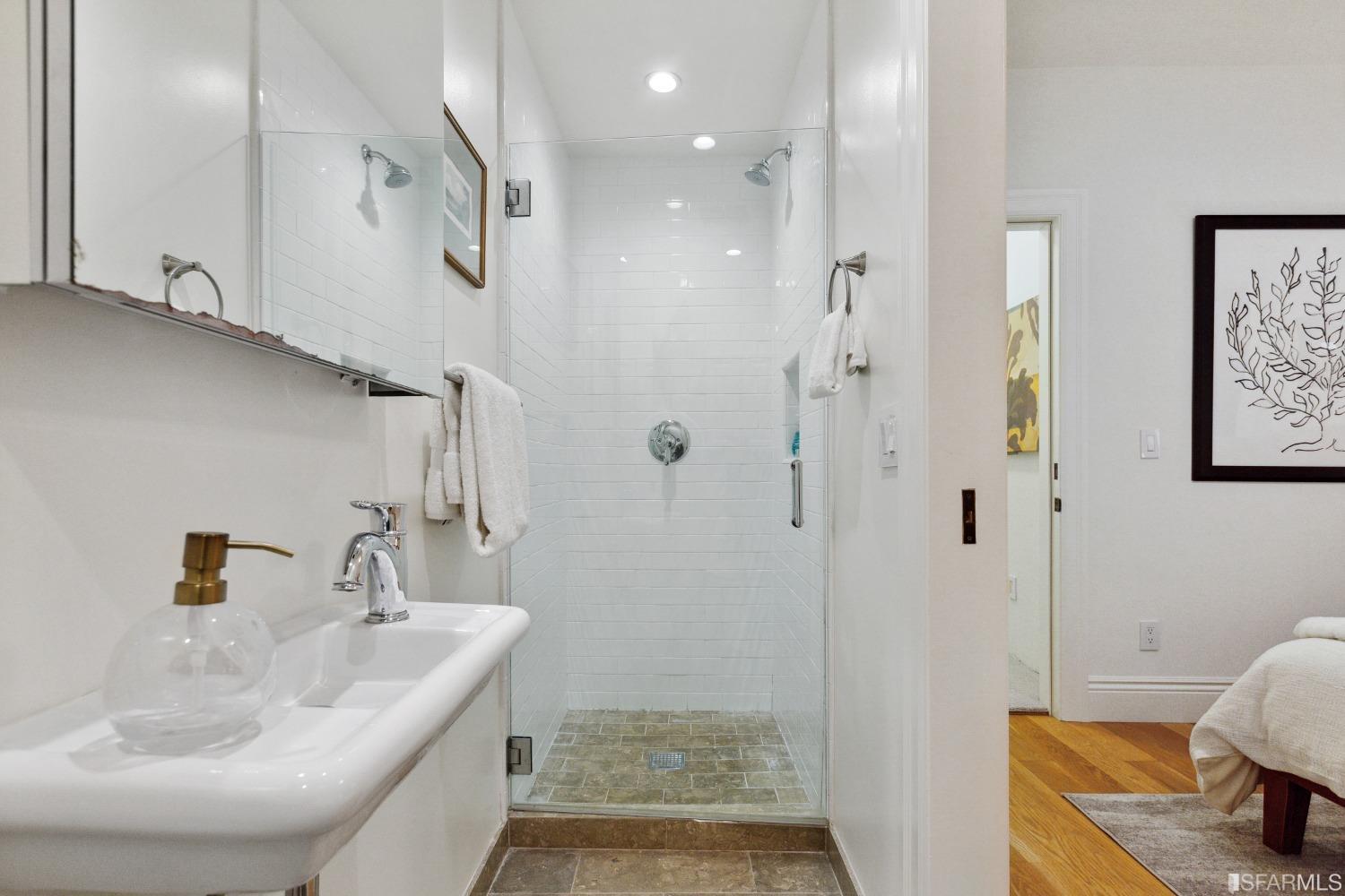 151 Broderick Street San Francisco, CA 94117 - Photo 32 of 39 a bathroom with a sink a toilet and shower