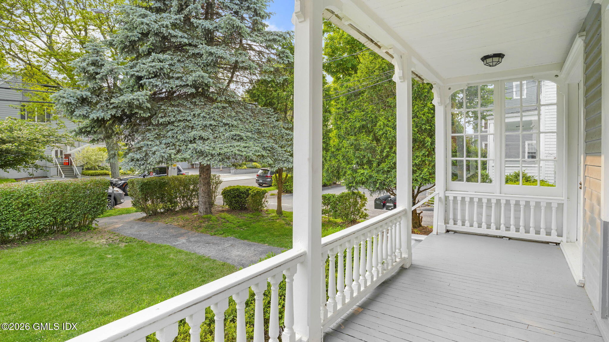43 Church Street, Unit 1 Greenwich, CT 06830 - Photo 16 of 17 a view of a porch with a yard