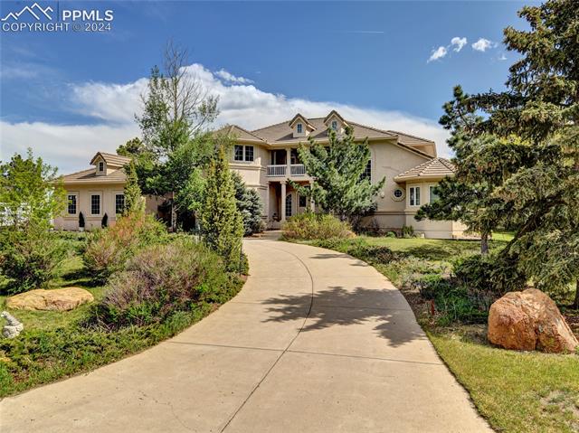 4555 Red Forest Road Monument, CO 80132 - Photo 3 of 12 View of front of house featuring a balcony